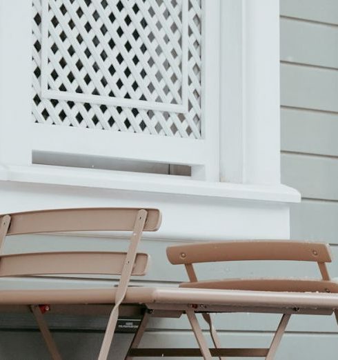 Small Deck Furniture - Snow on Chairs and Table of Outdoor Cafe