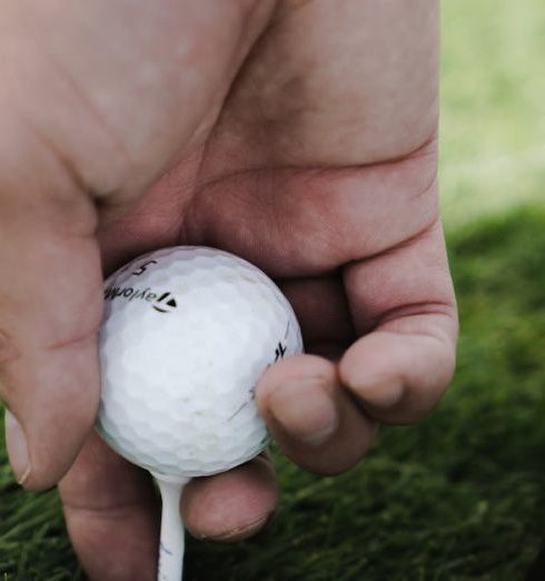 Outdoor Swings - Person Holding Golf Ball