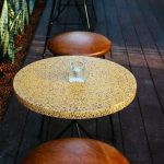 Snake Plants - Chairs and Tables by Building Wall