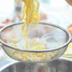 Stainless Steel Cookware - Unrecognizable women making homemade noodles for dinner