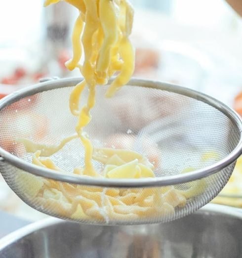 Stainless Steel Cookware - Unrecognizable women making homemade noodles for dinner