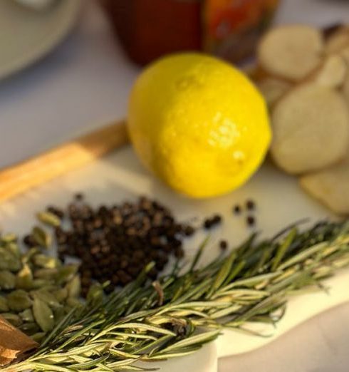 Spice Rack - Close-up of herbs and spices on a decorative tray with warm sunlight.