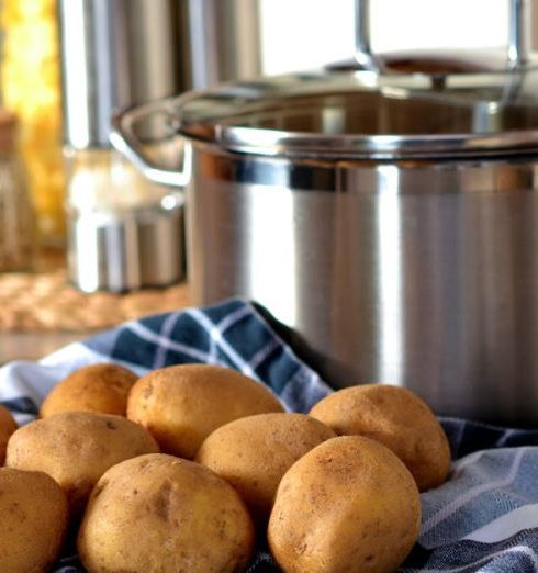 Cookware - Potatoes Beside Stainless Steel Cooking Pot