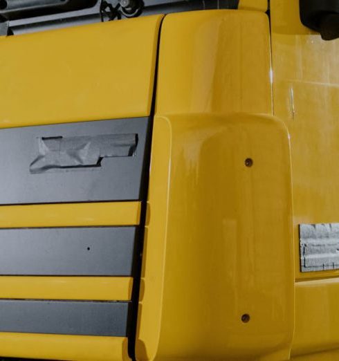 Paint Finish - A Yellow DAF XF Truck Close-Up Photo