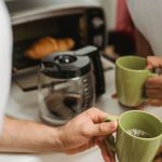 Toaster Ovens - Men Holding Mugs in Hands