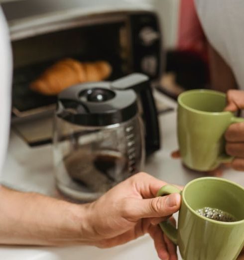 Toaster Ovens - Men Holding Mugs in Hands