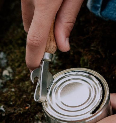 Can Opener - A Person Opening a Tin Can