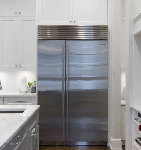 Fridge - Stainless Steel Refrigerator Beside White Kitchen Cabinet