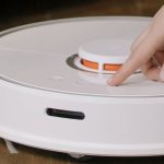 Smart Vacuum - White and Orange Plastic Container