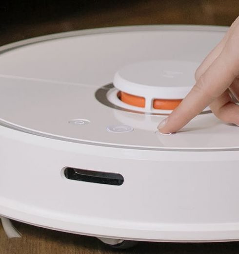 Smart Vacuum - White and Orange Plastic Container