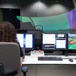 Command Center - Female Engineer Controlling Flight Simulator