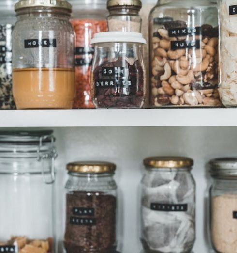 Pantry - Clear Glass Jars on White Wooden Shelf