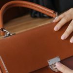 Closet Products - Person Holding Brown Leather Handbag