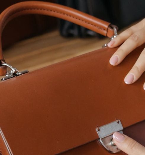 Closet Products - Person Holding Brown Leather Handbag