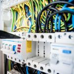 Cables - Electrician Fixing an Opened Switchboard