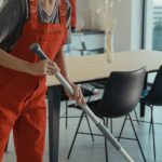 Cleaning Supplies - Woman Holding a Mop