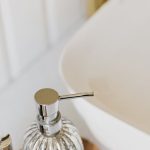 Organizing Products - Set of stylish cosmetic products placed near sink in bathroom