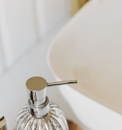 Organizing Products - Set of stylish cosmetic products placed near sink in bathroom