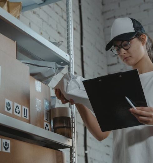 Mail Sorting - Woman in White T-shirt Holding Black Laptop Computer