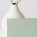 Monochromatic Palettes - Blank Green Paper Beside a White Flower Vase