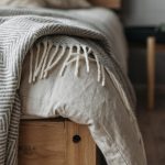 Shiplap Walls - Crumpled Blanket over a Bed