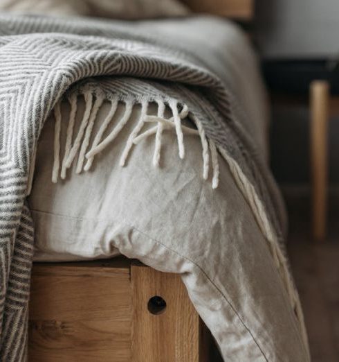 Shiplap Walls - Crumpled Blanket over a Bed