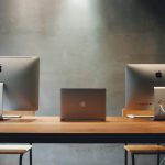 Dual-Purpose Furniture - Two Silver Imac on Table