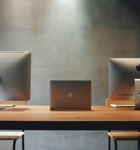 Dual-Purpose Furniture - Two Silver Imac on Table