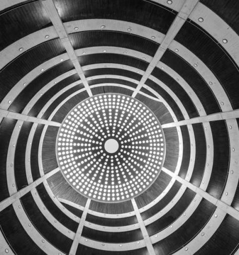 Heated Floors - A striking black and white view of a spiral architectural ceiling in Hamburg.