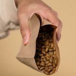 Pet Supplies - A Person Pouring Dog Food on the Bowl