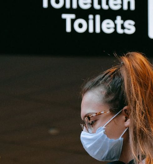 Security Signs - Woman With a Face Mask Texting