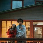 Backyard Security - Man and Woman Standing on Wooden Deck of a House