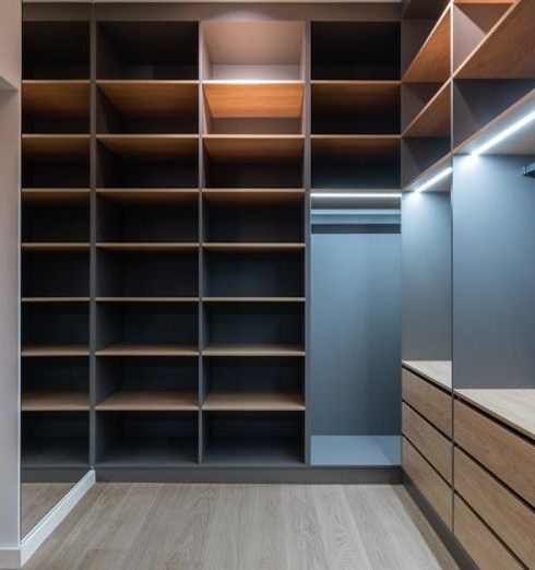 Closet Space - Interior of modern spacious wardrobe room with empty shelves near door and mirror