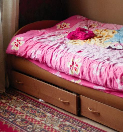 Under-Bed Storage - Pink Bedding on a Bed