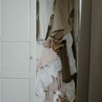 Linen Closet - Photo of an Untidy and Messy White Wooden Closet