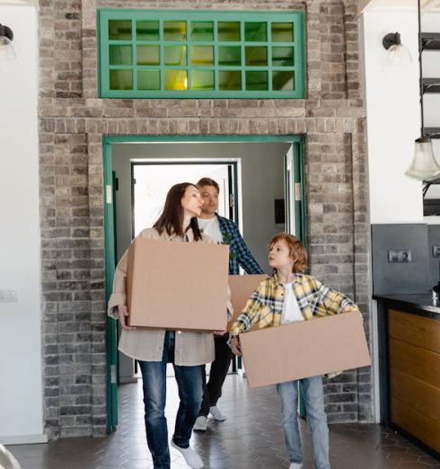 Entryway Storage - A Mother and Child Carrying Cardboard Boxes into the Kitchen Area