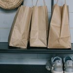 Shoe Storage - Brown Shopping Bags on Metal Rack