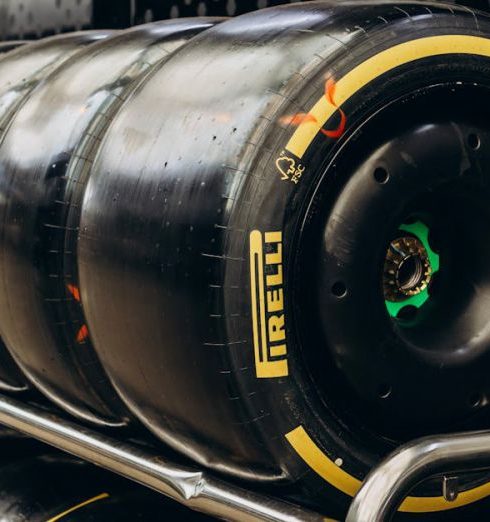 Garage Storage - Close-up shot of Pirelli racing tires stored in a garage. Ideal for motorsport content.