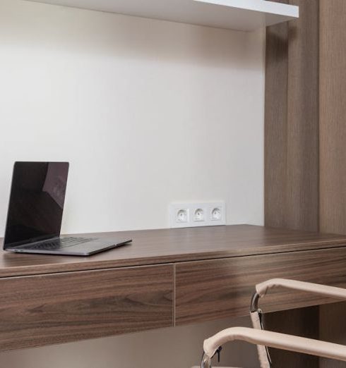 Floating Shelves - Room interior with chair near table with laptop