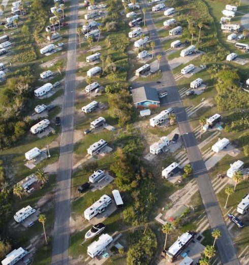 RVs And Campers - Aerial Footage with Campers on a Car Park