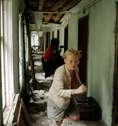 Kids’ Rooms - A Kid Wearing Brown Coat Running Inside Abandoned Building