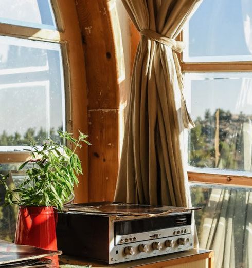 Mid-Century Modern - Black Music Player on Brown Wooden Desk