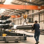 Industrial Materials - a worker using crane