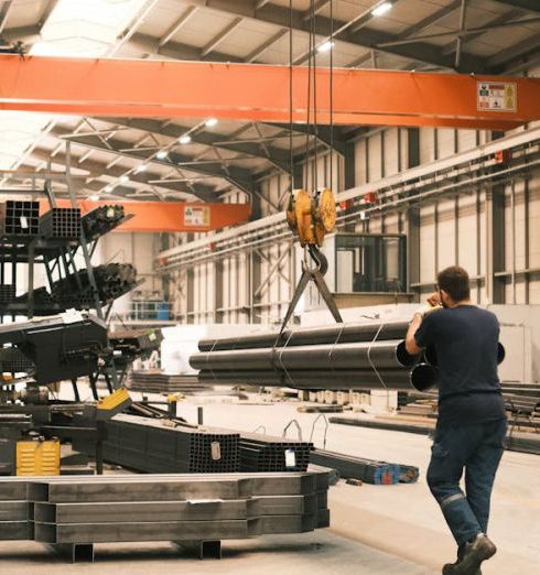 Industrial Materials - a worker using crane