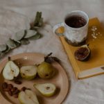 French Country - Sliced Pears on a Plate on Top of White Textile