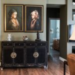 Retro Furniture - Black Wooden Cabinet Under Two Women Paintings