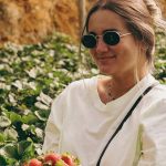 Soil Quality - Blonde Woman with Strawberries in Plastic Container