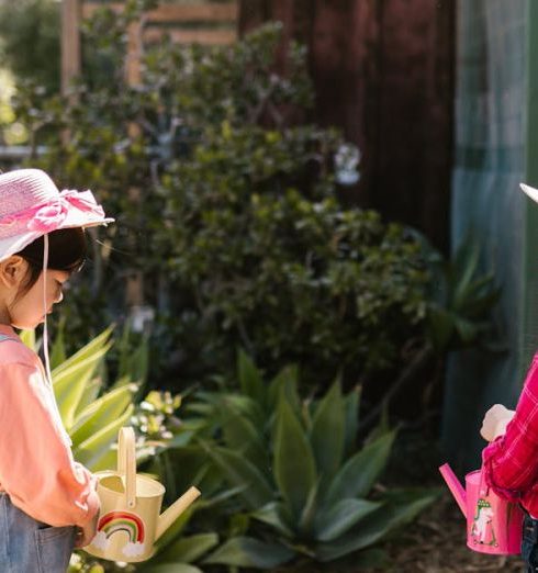 Raised Bed - Two Young Girls Holding Watering Cans