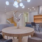 Lighting - Round Brown Wooden Table With Chairs Inside Room