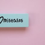 Mistakes - Minimalist eraser with 'I Love Mistakes' message on pink background, school stationery.